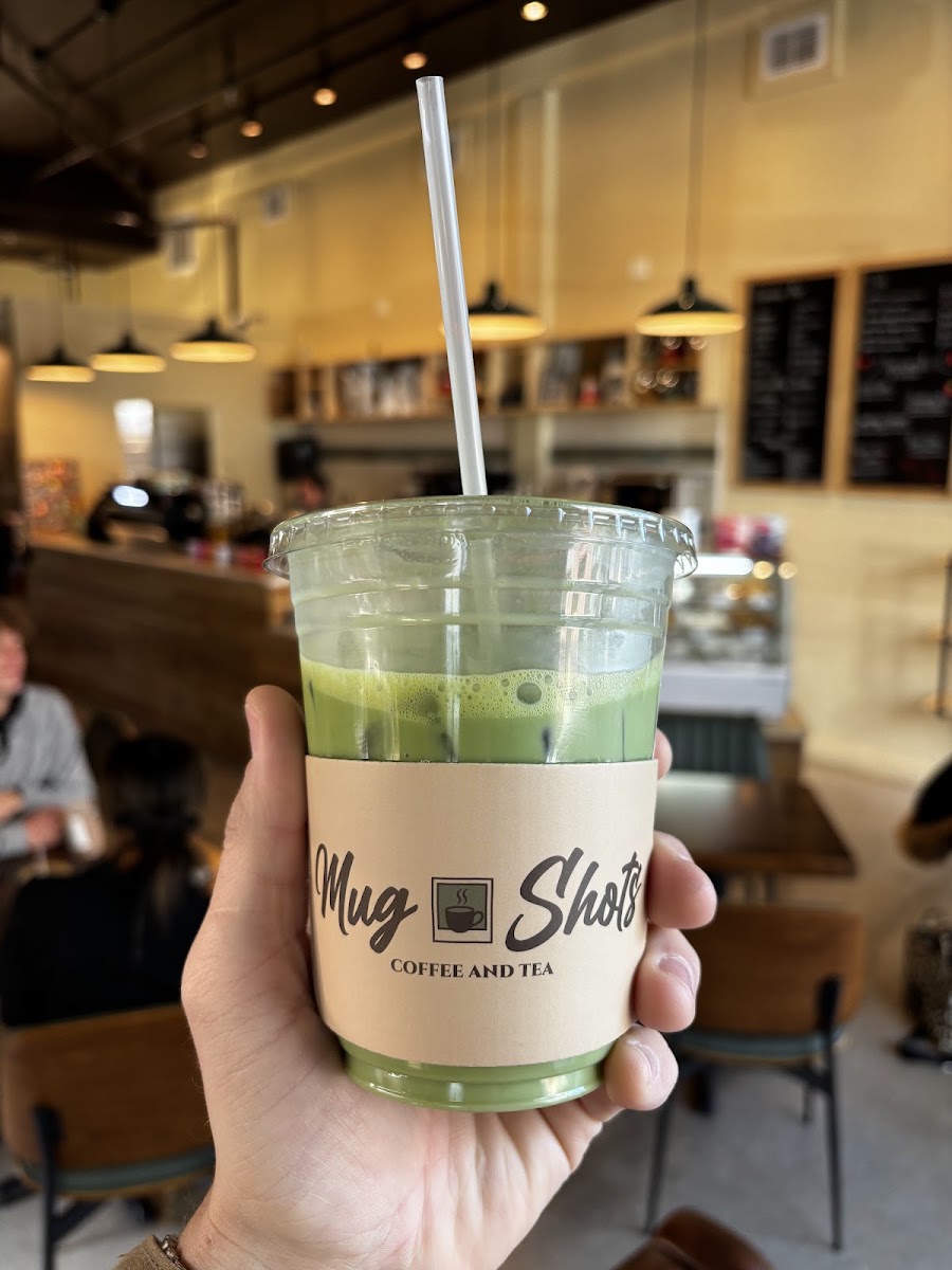 A Mug Shots iced matcha inside the café